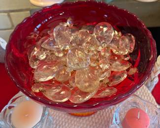 Vintage Tear-dropped shaped glass prisms for lamps, chandeliers, etc. These have been relocated and are currently at the register table area. Have about 40 total: approximately 10 larger ones and 30 smaller ones. The red bowl is still in its original location. 