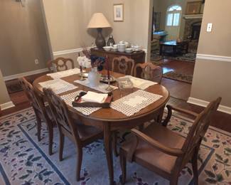Gorgeous dining set 6 chairs/table has been covered with pads, which are for sale as well!