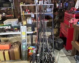 Various fishing rods and reels . 