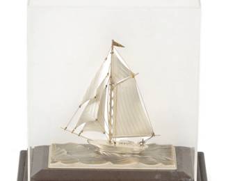 Lot 24
Seki Takehiko (Japanese, B. 1908) .960 Sterling Silver Ship Model, Mid 20th C., 'One Mast Yacht', H 5" L 5.25"
