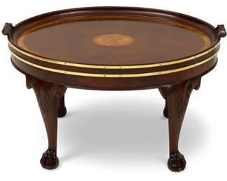 Lot 73
Baker Furniture Company Stately Homes Carved Mahogany Oval Top Coffee Table 20th Cen., H 18" W 22" L 31.5"