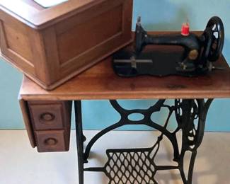 Antique Singer Treadle Sewing Machine With a Wooden Cabinet