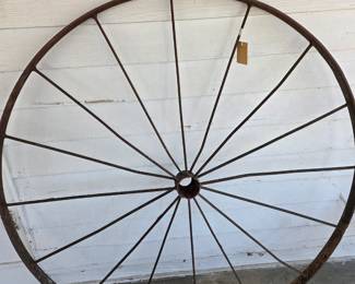 Possibility a carriage wheel circa late 19th century.