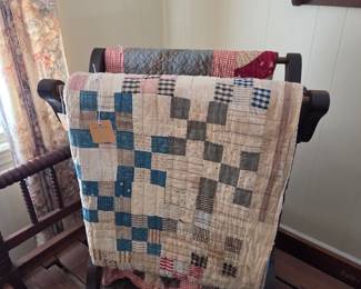 Two vintage cotton quilts & quilt stand.