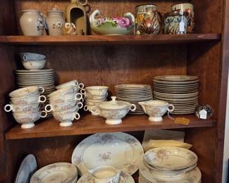 Lower two shelves: Dinner Service by Haviland American. "Apple Blossom"