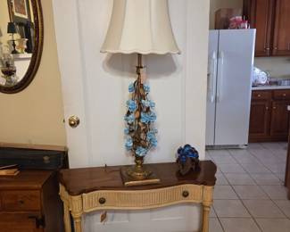 Hollywood Regency Console & Italian glided metal & porcelain carnations Italian lamp circa 1965.