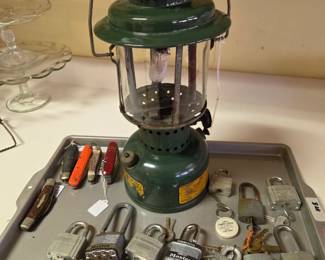 Various locks w/ keys, pocketknives and an old Coleman Camp Lantern.