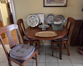 American Oak dining table and chairs. Collection of Hand Wrought Aluminum hostess ware circa early 1950s.