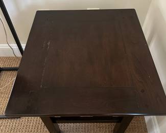 R117 - $15. Wooden Side Table with some minor surface wear. Measures 23" x 21" x 21.25". 