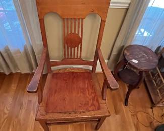 R134 - $50. Single Chair Solid Wood. Antique or very vintage. The chair was once caned and later a solid piece was placed on the top. Measures 22" wide x 17.25" x 42.5" tall. 