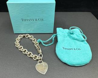 A9 - $150. Tiffany & Co. Sterling Heart Tag Bracelet. Measures 7.5" long. Has been worn so heart some some scratches & wear. 