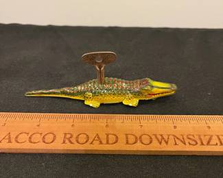 R221 - $25. Dizzy Liz The Whirling Baby Alligator with Key. Winds but doesn't move. 