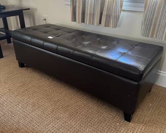 R116 - $35. Storage Bench. Measures 50" long x 19" deep x 15.25" tall. Faux Leather in good condition!