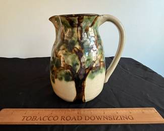 P94 - $15. Janet Resnik Pottery Pitcher. Measures 7.5" tall. No issues noted. 