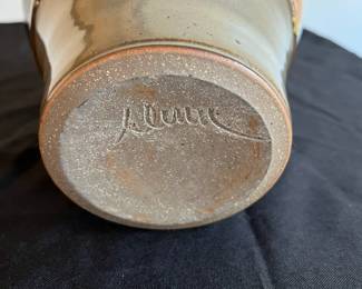 P95 - $15. Signed Pottery Vase. Measures 7" at the widest point x 10" tall. 