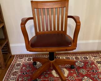 R151 - $50. Swivel, Rolling Office Chair with leather seat. Measures 25.25" wide x 25" deep x adjust from 32.5 - 36" tall. 