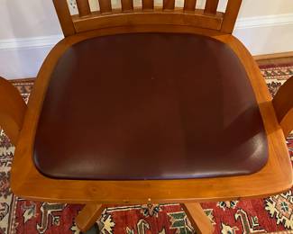R151 - $50. Swivel, Rolling Office Chair with leather seat. Measures 25.25" wide x 25" deep x adjust from 32.5 - 36" tall. 