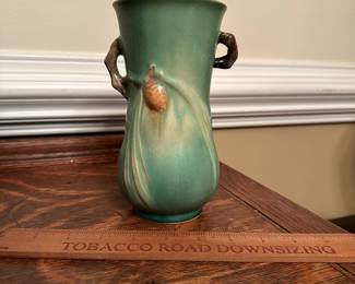 R201 -  $85. Roseville 841-7" 2 Handled Vase with Pinecones - Green. Measures 4" wide x 7" tall. 