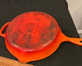 R242 - $45. Le Creuset 10.25" Skillet "Flame" Color. 