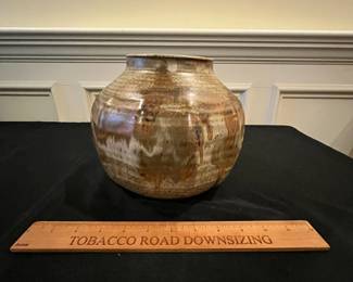 P67 - $20. Pottery Vase signed "Davis". Measures 9" wide x 8" tall. 