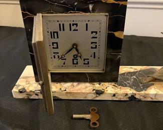R173 - $125. Art Deco Onyx & Stone Figural Mantle Clock. 18" long  x 7" tall. No key, untested and assuming it is not working. 