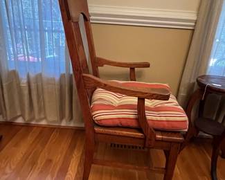 R134 - $50. Single Chair Solid Wood. Antique or very vintage. The chair was once caned and later a solid piece was placed on the top. Measures 22" wide x 17.25" x 42.5" tall. 
