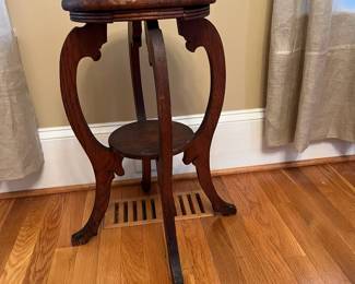 P17 - $35. Carved Oak Plant Stand / Fern Stand. Measures 12.5" x 25" tall. Top has water damage and some bending. Will still work great as a plant stand!