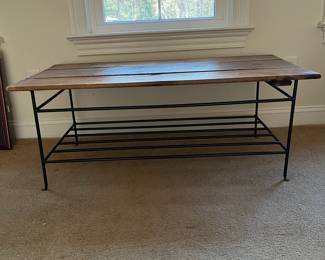 P98 - $40. Wooden Top Coffee table with Iron Base. Measures 47" wide x 23.5" x 18" tall. Would benefit from some reinforcements under the wood. 