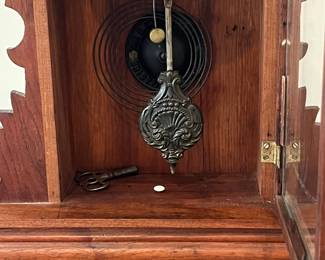 P80 - $40. "Rose" The E. Ingraham Co. Bristol CT. Gingerbread Case Kitchen Clock.  Measures 14.5" wide x 5" deep x 21.5" tall. Includes key - currently not working. 