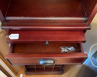 R133 - $65. Bar Cabinet with storage for wine, glasses & accessories. Single Drawer. Measures 18" wide x 13.5" deep x 70" tall. 