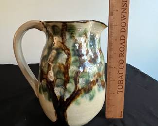 P94 - $15. Janet Resnik Pottery Pitcher. Measures 7.5" tall. No issues noted. 
