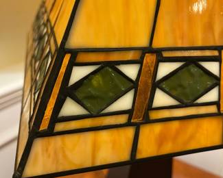 P73 - $40. Tiffany Style Table Lamp. Shade is in great condition but top that clips onto lamp harp needs adjusted. Measures 25" tall. 