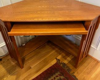 R137 - $75. Mission Style Corner Desk (2012). Has keyboard slide out. Comes out from each corner 34". Corner to corner is 48" x 30.25" tall. 