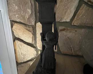 P62 - $125. 1930s Novelty Clock - Dutch Girl holding Umbrella next to a Grandfather Clock. Clock Face reads Made in France and Clock Case is also stamped Made in France. Measures 5" wide x 13" tall. Currently not running. 