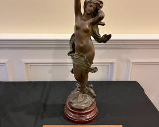 P64 - $125. Antique La Vague Par Moreau Lady Statue with Wooden Base painted with marbled look. Plaque on the bottom reads - "La Vague Par Hip. Moreau". Measures 20" tall. (I believe it is Spelter with bronze paint)