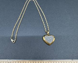 A2 - $400. 14kt gold necklace 16" twisting chain. Charm is 18kt with diamonds. 