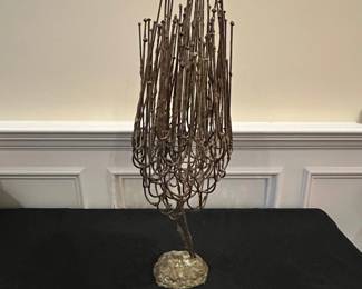 P63 - $75. Brutallist Sculpture. Unsigned. Measures 9" at the widest point x 24" tall. 