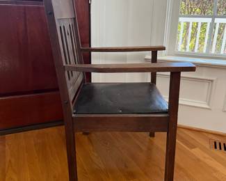 P11 - $75. Mission Style Single Arm Chair with Leather Seat. Measures 25" wide x 23" deep x 36" tall. 
