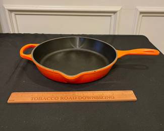 R242 - $45. Le Creuset 10.25" Skillet "Flame" Color. 