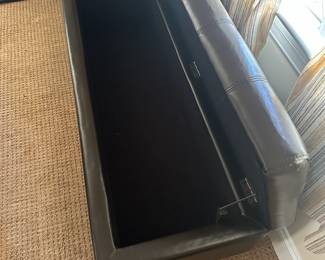 R116 - $35. Storage Bench. Measures 50" long x 19" deep x 15.25" tall. Faux Leather in good condition!