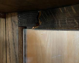 R276 - $95. Oak Bow Front Cabinet. Measures 34" wide x 15.5" deep x 58" tall. Top Curved Trim on the right side is cracked. All Glass is intact! Key is included. It does wiggle a little and needs some work. 