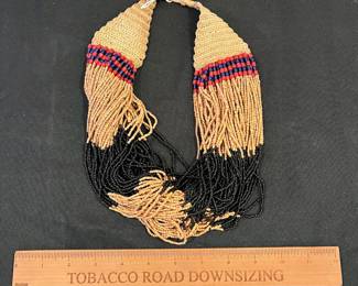 R146 - $50. Beaded Tribal Necklace with Bone Button Closure. Believed to be early 1900s India.