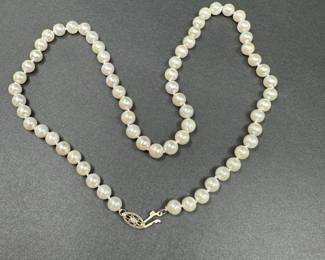 A10 - $125. 18" String of Pearls. 14kt clasp.