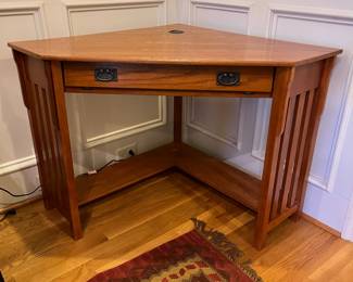 R137 - $75. Mission Style Corner Desk (2012). Has keyboard slide out. Comes out from each corner 34". Corner to corner is 48" x 30.25" tall. 