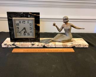 R173 - $125. Art Deco Onyx & Stone Figural Mantle Clock. 18" long  x 7" tall. No key, untested and assuming it is not working. 
