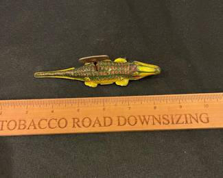 R221 - $25. Dizzy Liz The Whirling Baby Alligator with Key. Winds but doesn't move. 
