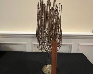 P63 - $75. Brutallist Sculpture. Unsigned. Measures 9" at the widest point x 24" tall. 