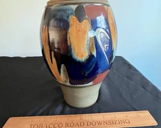 P95 - $15. Signed Pottery Vase. Measures 7" at the widest point x 10" tall. 