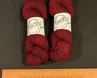 R235 - $30. 2 Skeins Plucky Knitter "Scarlet"