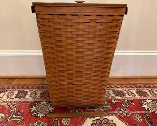 R240 - $85. Vintage Longaberger Laundry Basket. Measures 17.25" square x 22.5" tall. Has plastic liner which is in excellent condition!